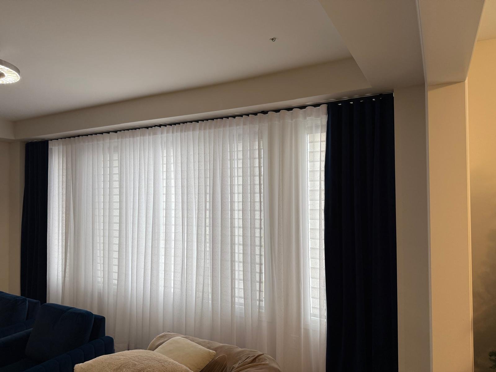 Toronto living room sheer drapery with dark side panels