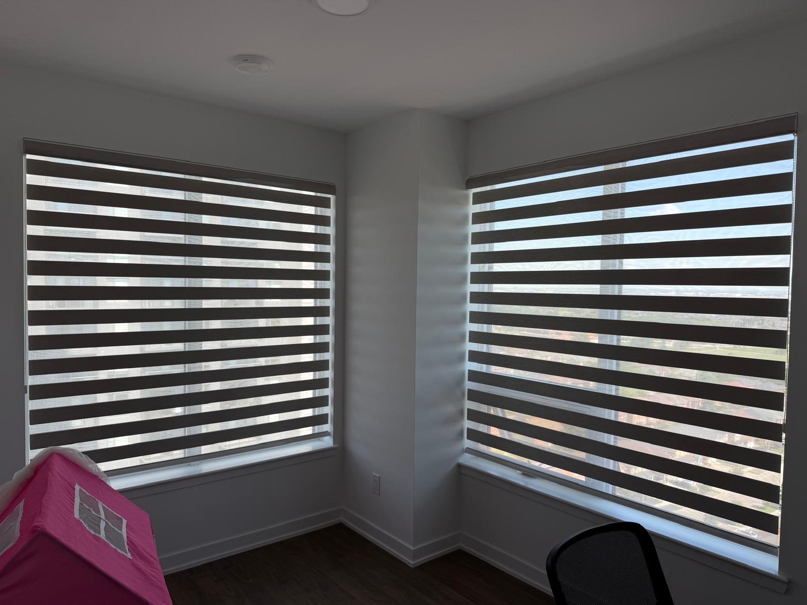Toronto office zebra shades installed on corner windows
