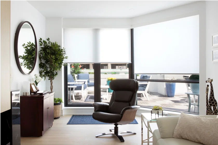 Solar shades reducing glare in a bright room